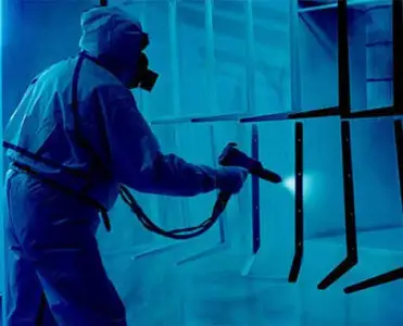 Manual coating operator in spray booth